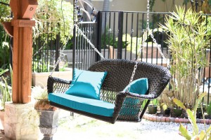 Espresso Resin Wicker Porch Swing with Sky Blue Cushion