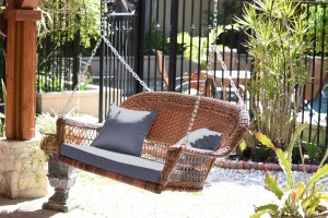 Honey Resin Wicker Porch Swing with Steel Blue Cushion