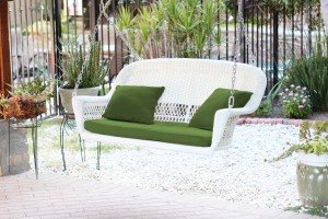 White Resin Wicker Porch Swing with Hunter Green Cushion