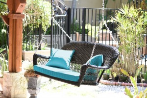 Black Resin Wicker Porch Swing with Sky Blue Cushion
