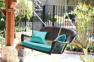 Black Resin Wicker Porch Swing with Turquoise Cushion