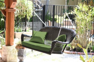 Black Resin Wicker Porch Swing with Hunter Green Cushion
