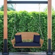 Honey Resin Wicker Porch Swing with Midnight Blue Cushion